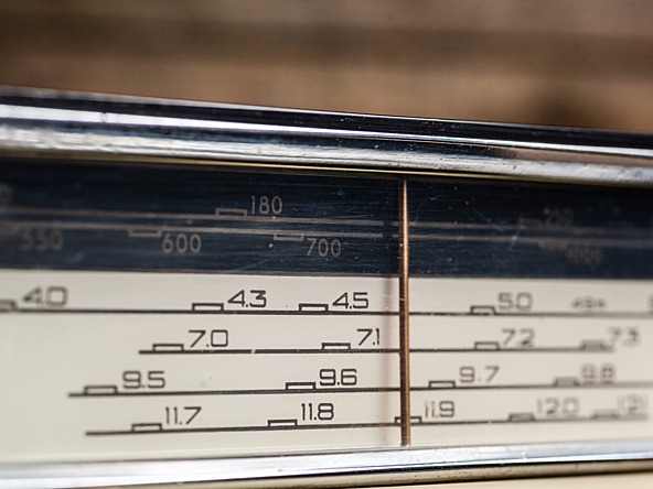 Vintage radio dial showing frequencies